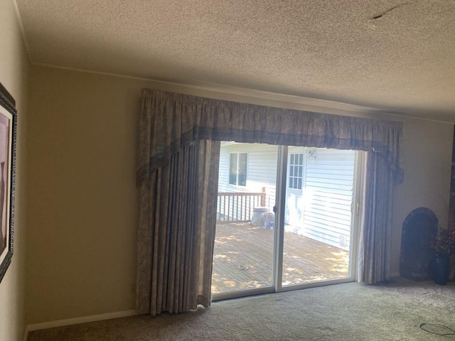 140 Oriole Dr, Alpena, MI 49707 - carpeted empty room featuring a textured ceiling and ornamental molding