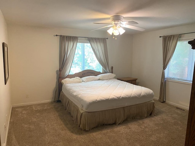 140 Oriole Dr, Alpena, MI 49707 - bedroom featuring carpet and a ceiling fan
