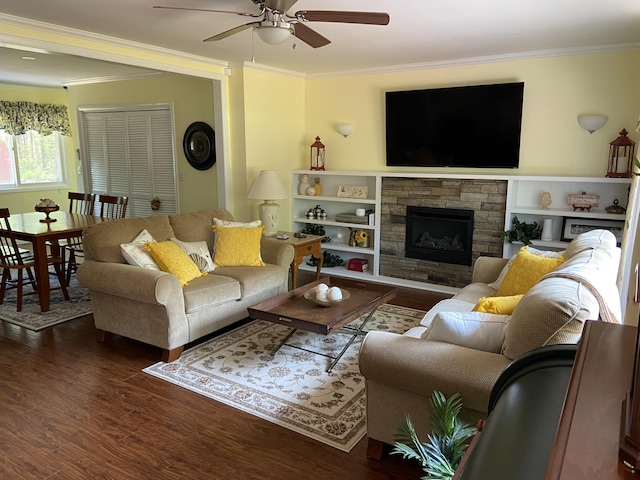 3350 Woodcrest Dr, Lewiston, MI 49756 - living room with crown molding, a ceiling fan, wood finished floors, and a fireplace