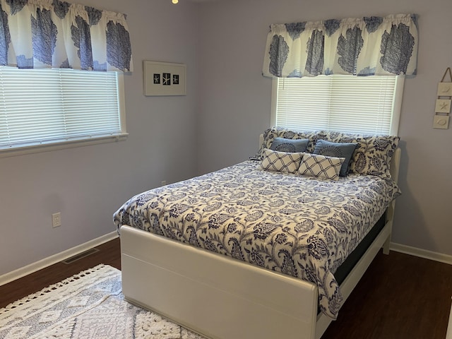 3350 Woodcrest Dr, Lewiston, MI 49756 - bedroom with wood finished floors and baseboards