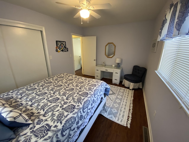 3350 Woodcrest Dr, Lewiston, MI 49756 - bedroom featuring dark wood-type flooring and ceiling fan