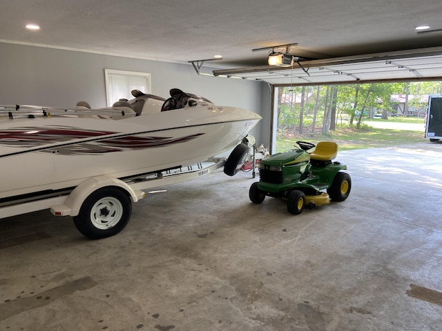 3350 Woodcrest Dr, Lewiston, MI 49756 - garage featuring a garage door opener and recessed lighting