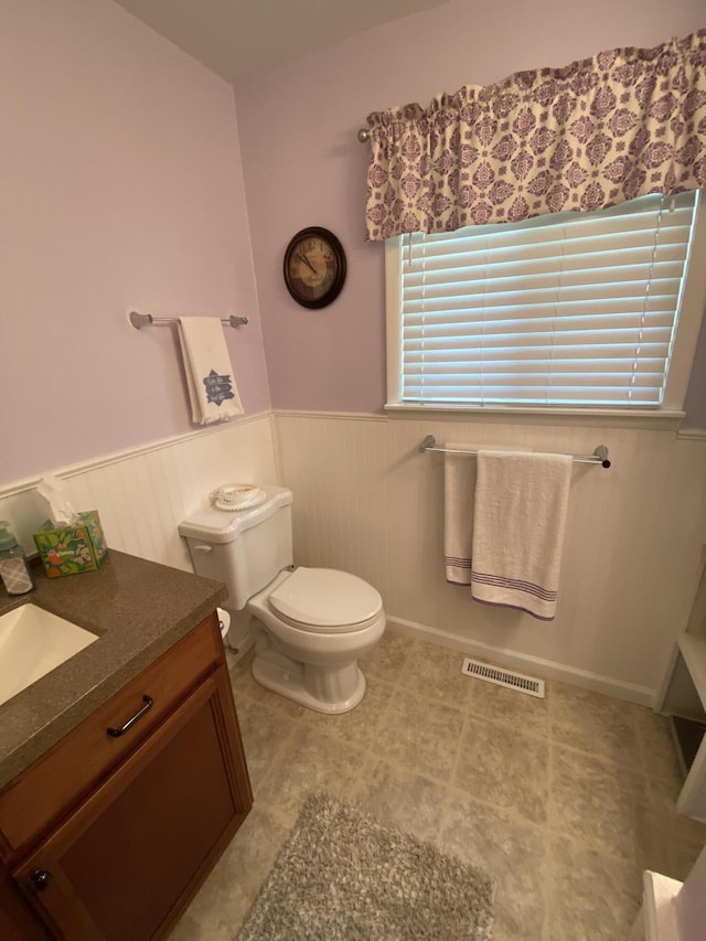 3350 Woodcrest Dr, Lewiston, MI 49756 - bathroom with a wainscoted wall and vanity