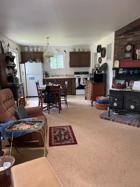 22551 Theiner Trl, Hillman, MI 49746 - living area with light colored carpet