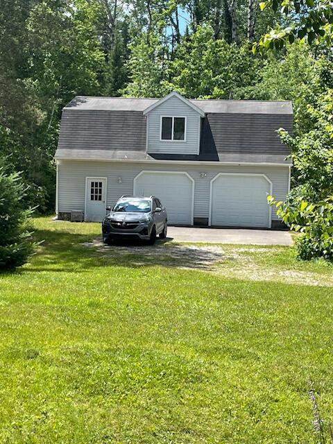 22551 Theiner Trl, Hillman, MI 49746 - garage featuring driveway