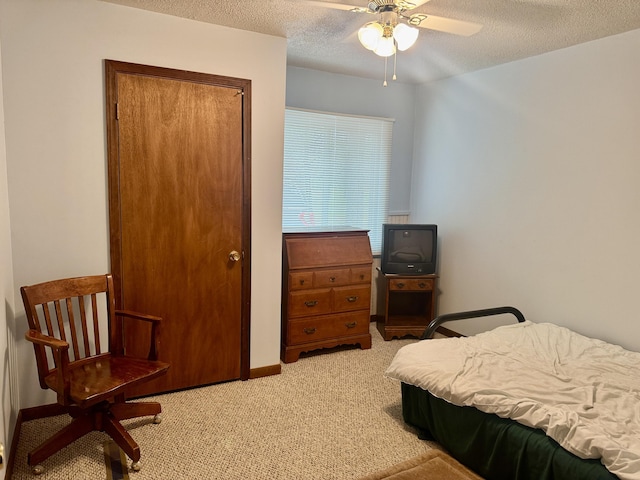 36 S Mcmasters Bridge Rd, Grayling, MI 49738 - bedroom featuring light colored carpet, a textured ceiling, a closet, and a ceiling fan