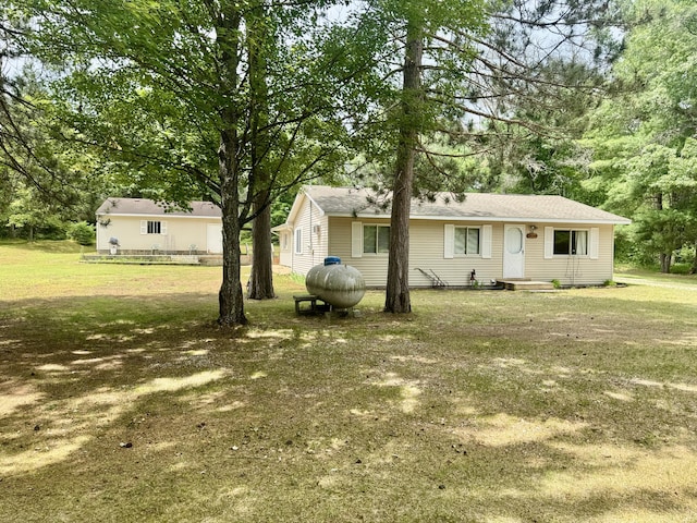 36 S Mcmasters Bridge Rd, Grayling, MI 49738 - view of front of house with a front lawn