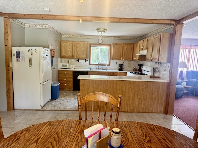 36 S Mcmasters Bridge Rd, Grayling, MI 49738 - kitchen featuring white appliances, under cabinet range hood, a peninsula, light tile patterned flooring, and light countertops