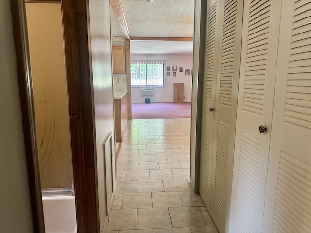 36 S Mcmasters Bridge Rd, Grayling, MI 49738 - hall featuring a textured ceiling, light tile patterned flooring, a wall mounted air conditioner, and light colored carpet