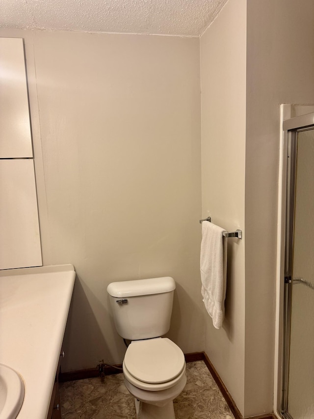 36 S Mcmasters Bridge Rd, Grayling, MI 49738 - bathroom with vanity, a textured ceiling, and an enclosed shower