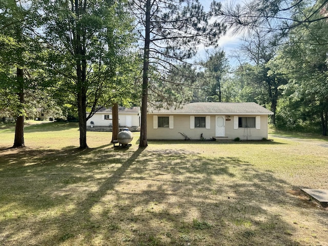 36 S Mcmasters Bridge Rd, Grayling, MI 49738 - ranch-style home featuring a front lawn and view of wooded area