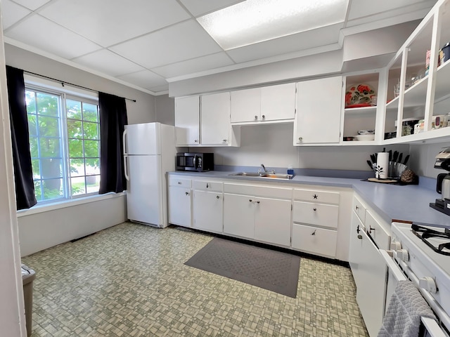 7931 Mill St, Vanderbilt, MI 49795 - kitchen featuring white appliances, white cabinets, open shelves, light countertops, and light floors