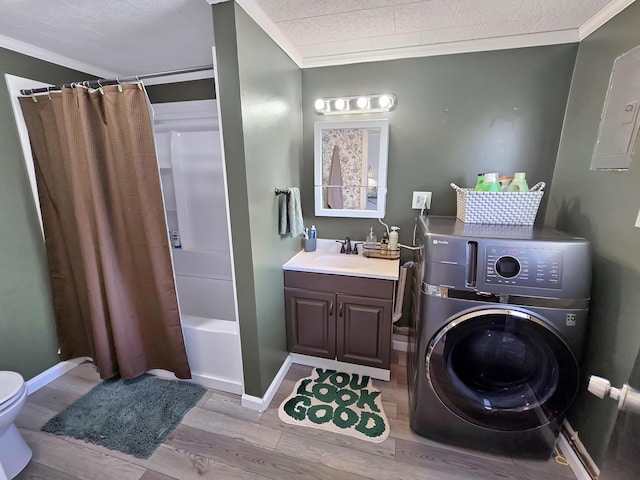 7931 Mill St, Vanderbilt, MI 49795 - bathroom with washer / clothes dryer, ornamental molding, wood finished floors, vanity, and shower / bath combination with curtain