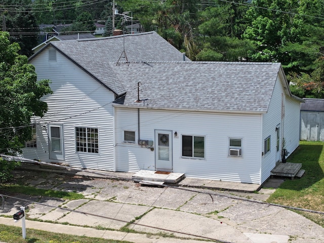 7931 Mill St, Vanderbilt, MI 49795 - back of property with a shingled roof