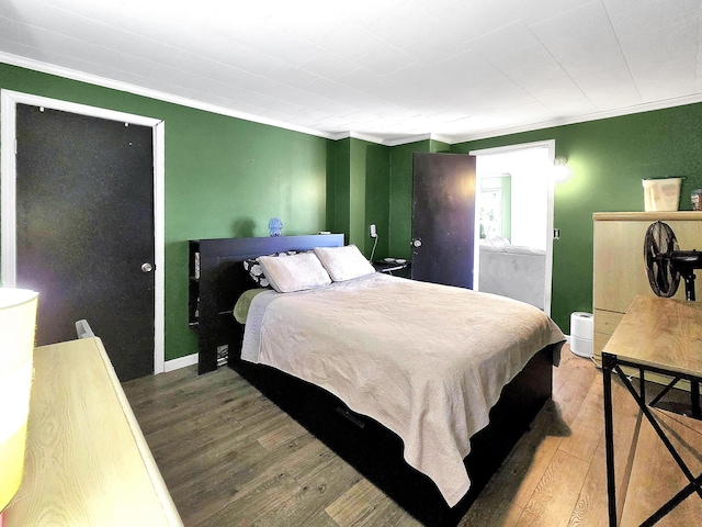 7931 Mill St, Vanderbilt, MI 49795 - bedroom featuring crown molding and wood finished floors