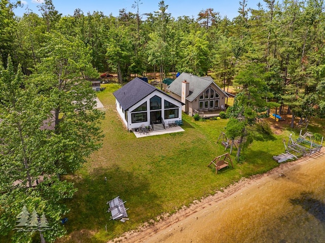 4620 Pinewood Dr, Lewiston, MI 49756 - aerial view of property and surrounding area featuring a heavily wooded area