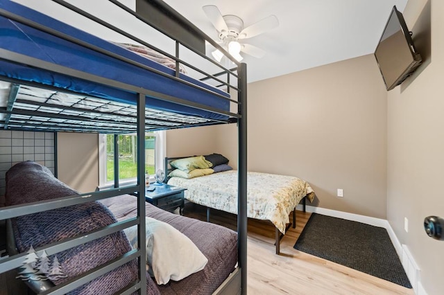 4620 Pinewood Dr, Lewiston, MI 49756 - bedroom featuring wood finished floors and a ceiling fan