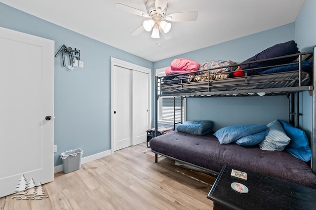 4620 Pinewood Dr, Lewiston, MI 49756 - bedroom featuring wood finished floors, a closet, and a ceiling fan