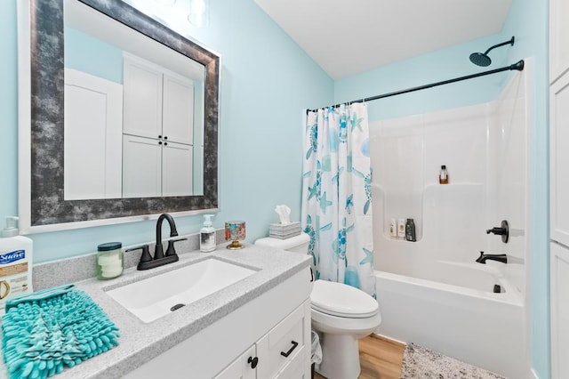 4620 Pinewood Dr, Lewiston, MI 49756 - bathroom featuring vanity, wood finished floors, and shower / bathtub combination with curtain