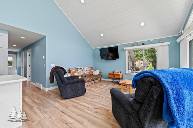 4620 Pinewood Dr, Lewiston, MI 49756 - living area featuring healthy amount of natural light, light wood finished floors, vaulted ceiling, and recessed lighting