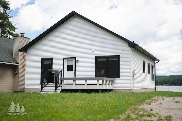 4620 Pinewood Dr, Lewiston, MI 49756 - rear view of house featuring a deck