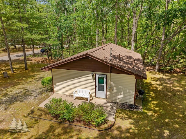 2911 Birch St, Lewiston, MI 49756 - view of outdoor structure with a forest view