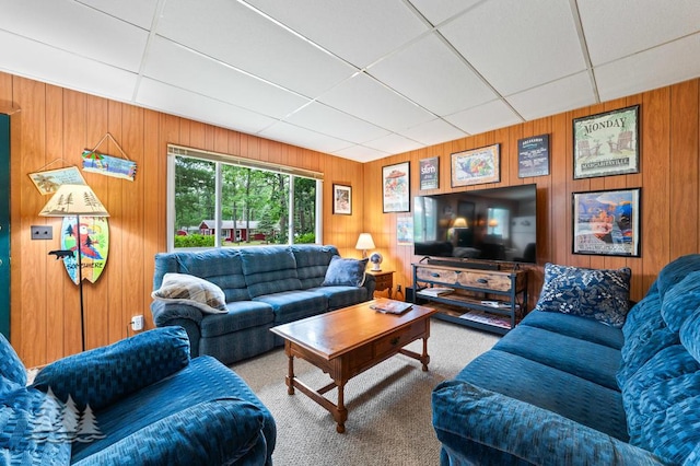 2911 Birch St, Lewiston, MI 49756 - carpeted living room with a paneled ceiling and wooden walls