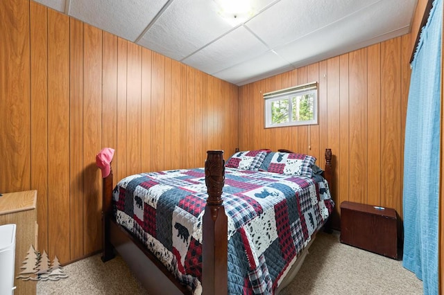 2911 Birch St, Lewiston, MI 49756 - bedroom featuring carpet, wooden walls, and a drop ceiling