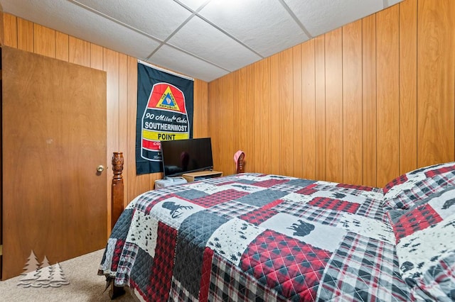 2911 Birch St, Lewiston, MI 49756 - carpeted bedroom featuring a drop ceiling and wooden walls
