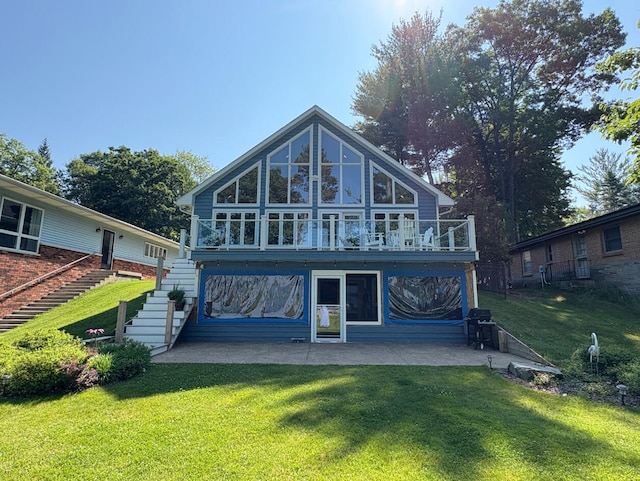 169 Pine Bluffs Rd, Roscommon, MI 48653 - back of house with stairs, a patio, and a yard