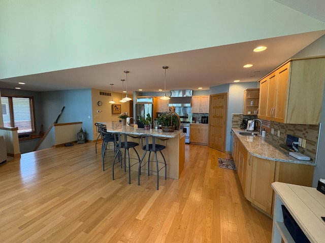 169 Pine Bluffs Rd, Roscommon, MI 48653 - kitchen featuring open shelves, stainless steel appliances, tasteful backsplash, a kitchen breakfast bar, and light wood-style floors