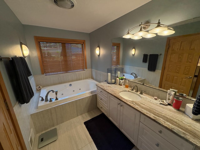 169 Pine Bluffs Rd, Roscommon, MI 48653 - full bathroom featuring vanity, a whirlpool tub, and wainscoting