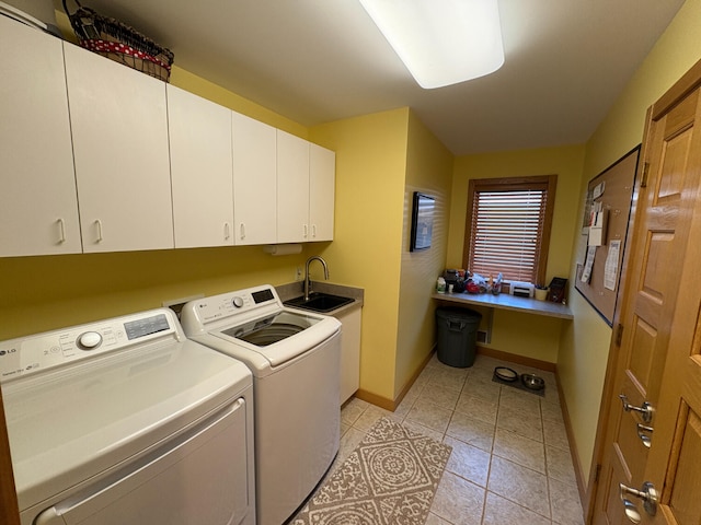 169 Pine Bluffs Rd, Roscommon, MI 48653 - washroom featuring cabinet space, separate washer and dryer, light tile patterned flooring, and a desk