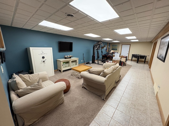 169 Pine Bluffs Rd, Roscommon, MI 48653 - living area with a paneled ceiling and light tile patterned floors