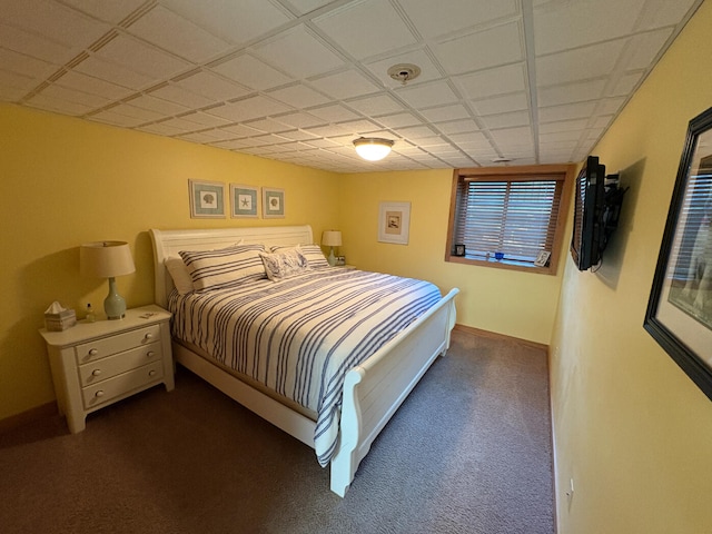 169 Pine Bluffs Rd, Roscommon, MI 48653 - carpeted bedroom with a paneled ceiling and baseboards