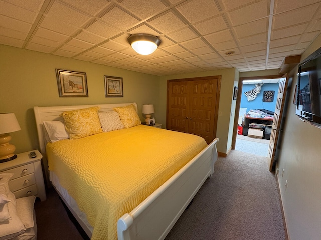169 Pine Bluffs Rd, Roscommon, MI 48653 - carpeted bedroom with a closet and a paneled ceiling