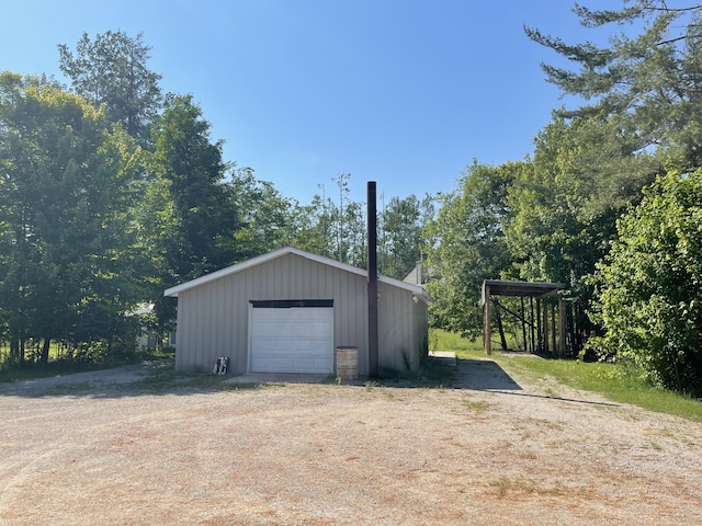 12395 Atkinson Rd, Lachine, MI 49753 - detached garage with dirt driveway