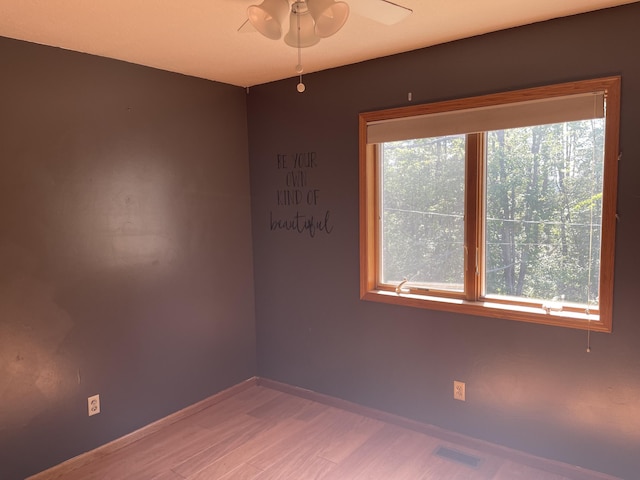 12395 Atkinson Rd, Lachine, MI 49753 - empty room featuring light wood-style flooring and ceiling fan