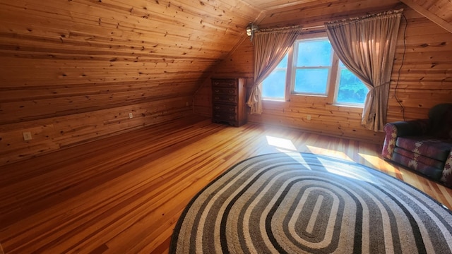1025 Lake Side Trl, Barton City, MI 48705 - bonus room with wooden walls, lofted ceiling, and hardwood / wood-style floors