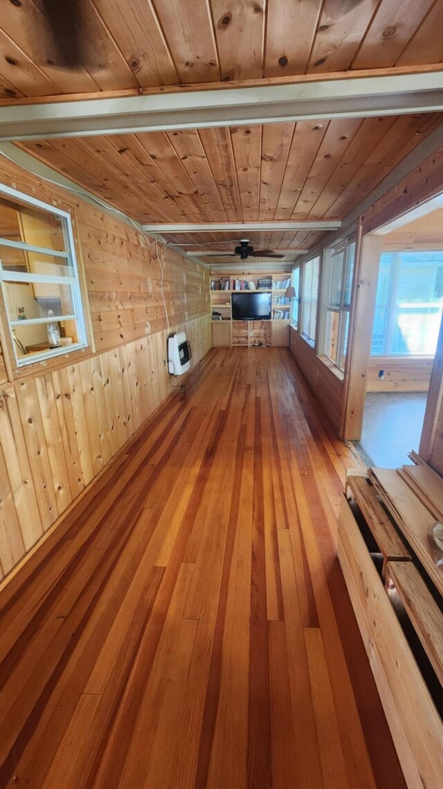 1025 Lake Side Trl, Barton City, MI 48705 - unfurnished room featuring wooden ceiling, wooden walls, wood-type flooring, and heating unit