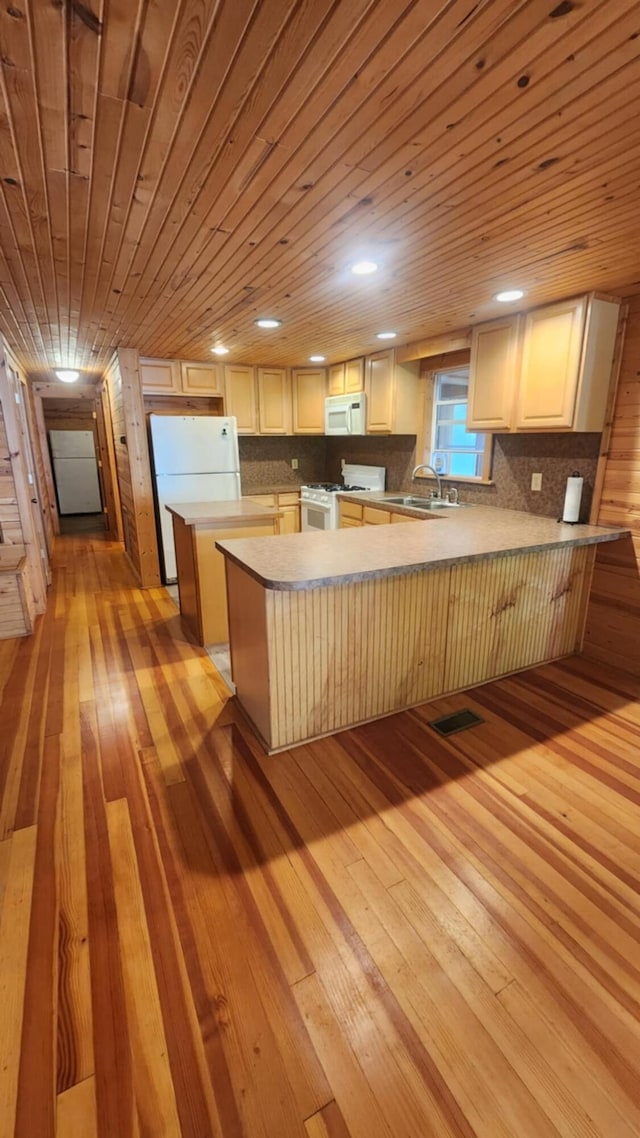 1025 Lake Side Trl, Barton City, MI 48705 - kitchen featuring white appliances, light wood-style flooring, a peninsula, wooden ceiling, and decorative backsplash