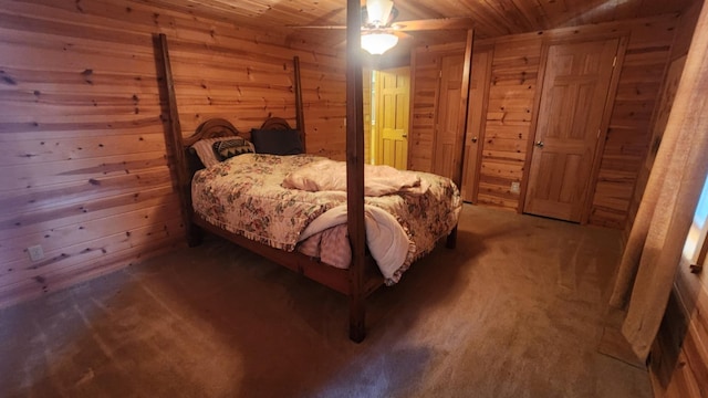 1025 Lake Side Trl, Barton City, MI 48705 - bedroom with wood walls, carpet floors, wooden ceiling, and a ceiling fan