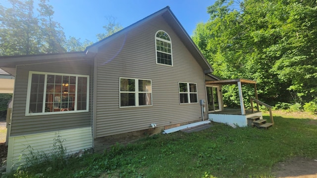 1025 Lake Side Trl, Barton City, MI 48705 - view of side of home featuring a yard