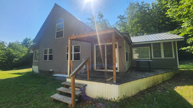 1025 Lake Side Trl, Barton City, MI 48705 - back of house with a wooden deck and a lawn