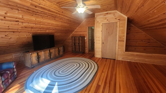 1025 Lake Side Trl, Barton City, MI 48705 - unfurnished living room with lofted ceiling, wood-type flooring, a ceiling fan, wood walls, and wood ceiling