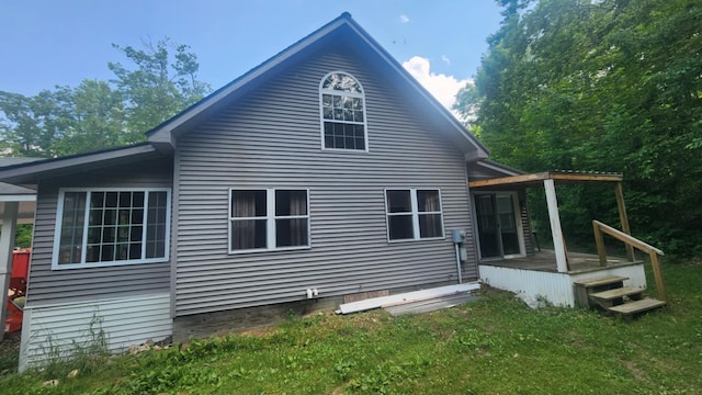 1025 Lake Side Trl, Barton City, MI 48705 - rear view of property with a yard