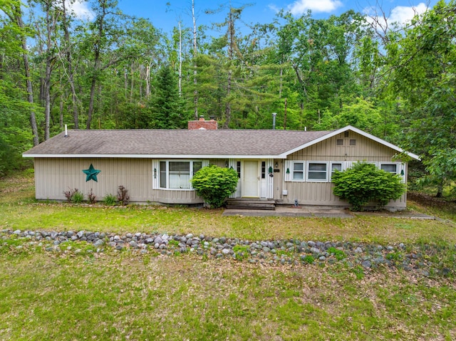 5699 N Red Oak Rd, Lewiston, MI 49756 - ranch-style house with roof with shingles and a chimney