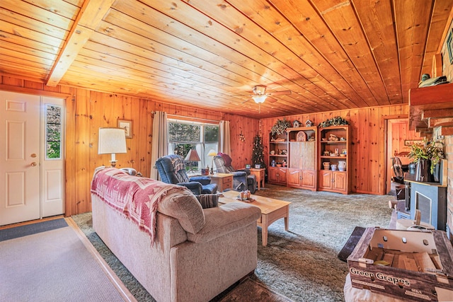 5699 N Red Oak Rd, Lewiston, MI 49756 - carpeted living area with wooden ceiling and wood walls