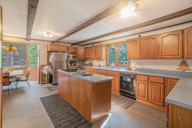 5699 N Red Oak Rd, Lewiston, MI 49756 - kitchen with appliances with stainless steel finishes, beamed ceiling, plenty of natural light, a kitchen island, and light countertops