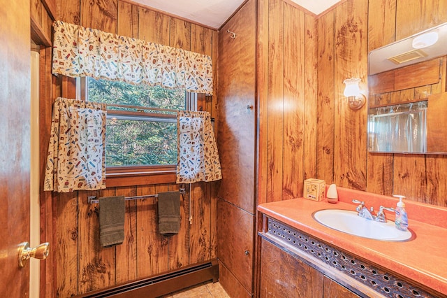 5699 N Red Oak Rd, Lewiston, MI 49756 - bathroom featuring vanity, a baseboard heating unit, and wood walls